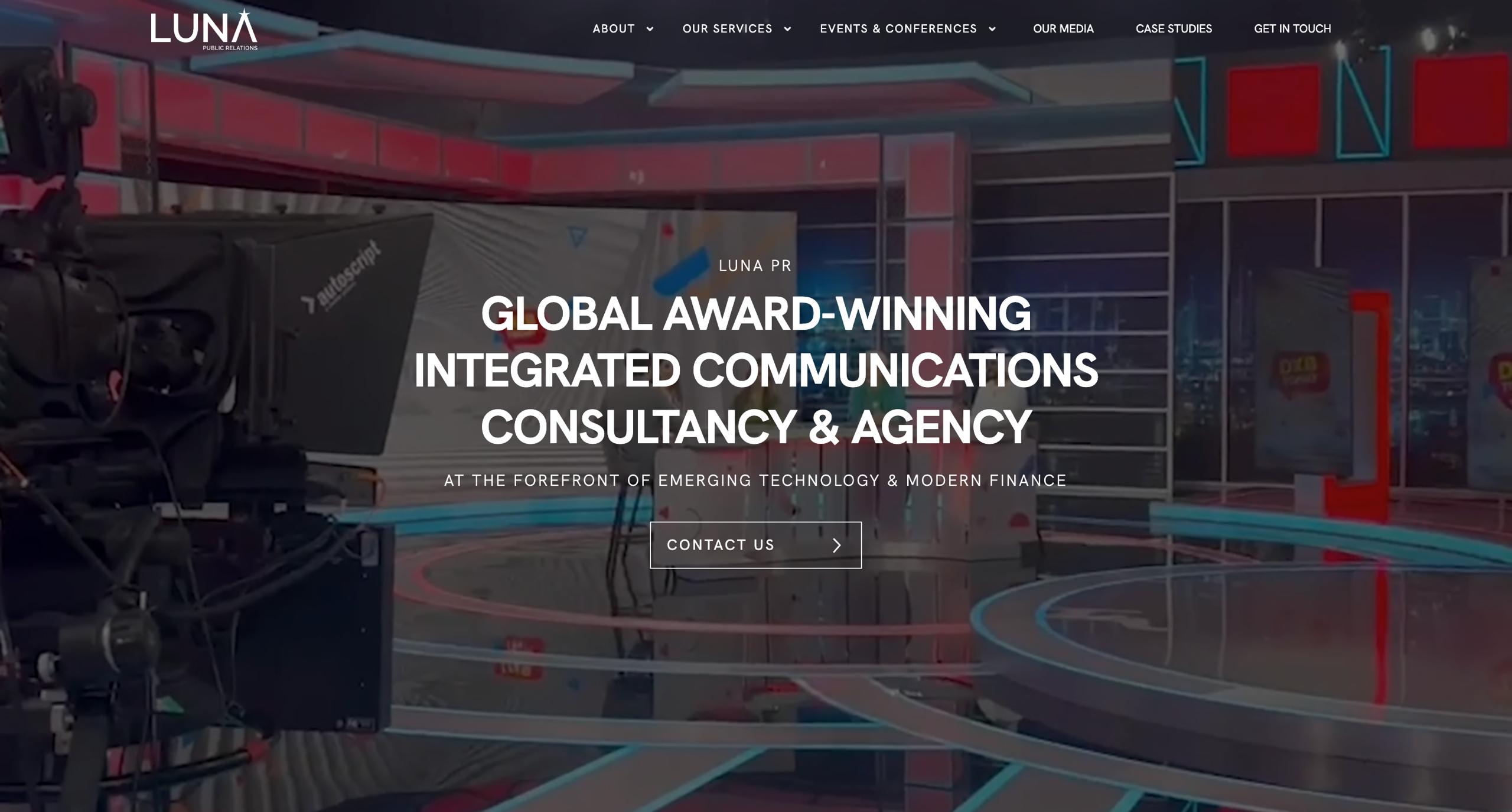 Global technology and finance communications agency homepage featuring a futuristic studio and media production setting.