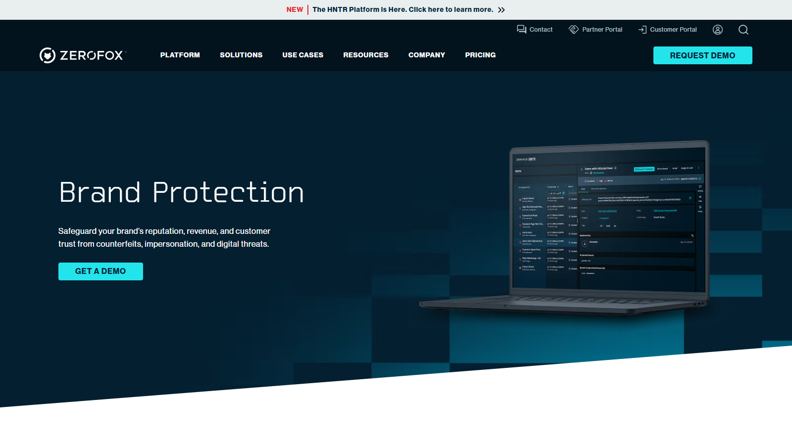 ZeroFox Brand Protection page with a laptop showing alerts in the HNTR platform dashboard and a Get a Demo button.